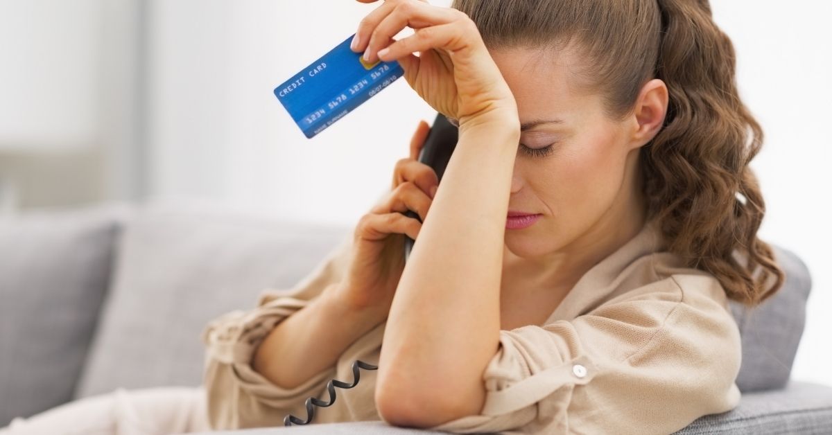 woman stressed after compulsive spending online